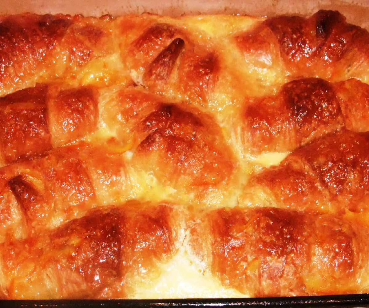 Croissant breakfast casserole made with orange marmalade, eggs, and cream--luscious, and super easy.