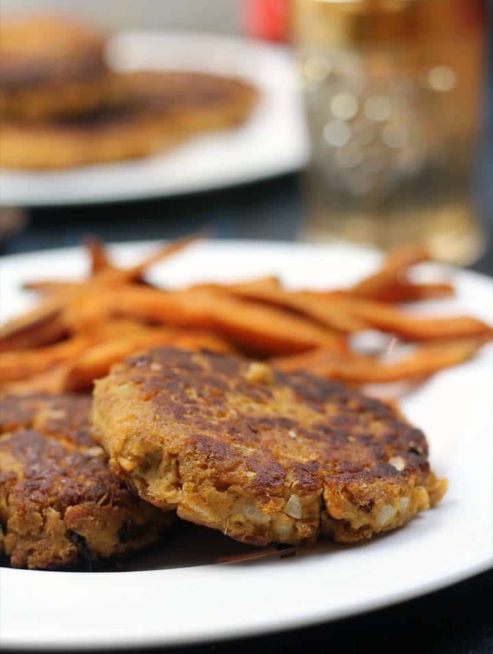 Cooked salmon patties on a plate. 