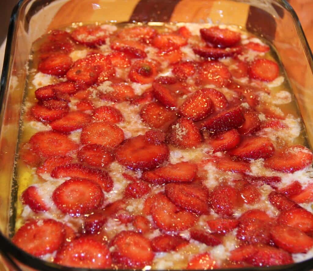 Strawberries in the batter in a bowl. 