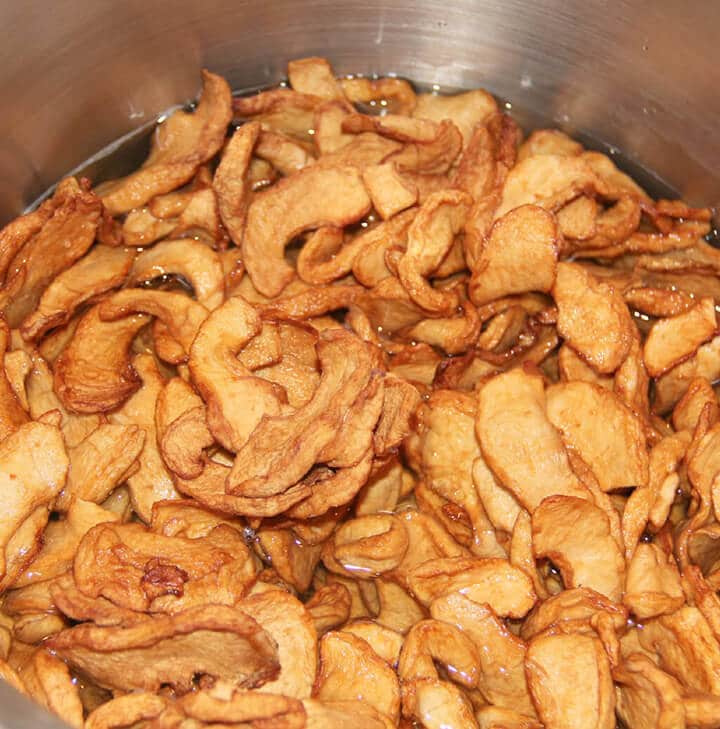 Dried apples in a pot to cook for fried apple pies.