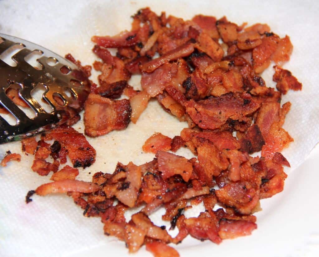 chopped cooked bacon on a plate.