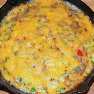 Oven baked omelet in a cast iron skillet.