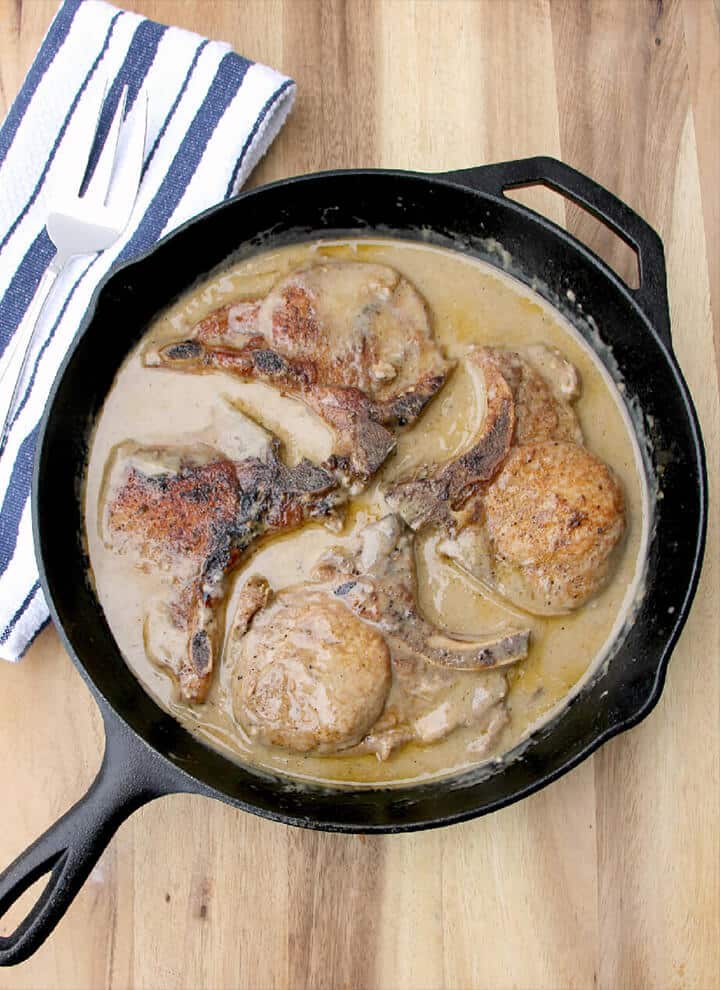 Skillet with baked pork chops and cream of mushroom soup.