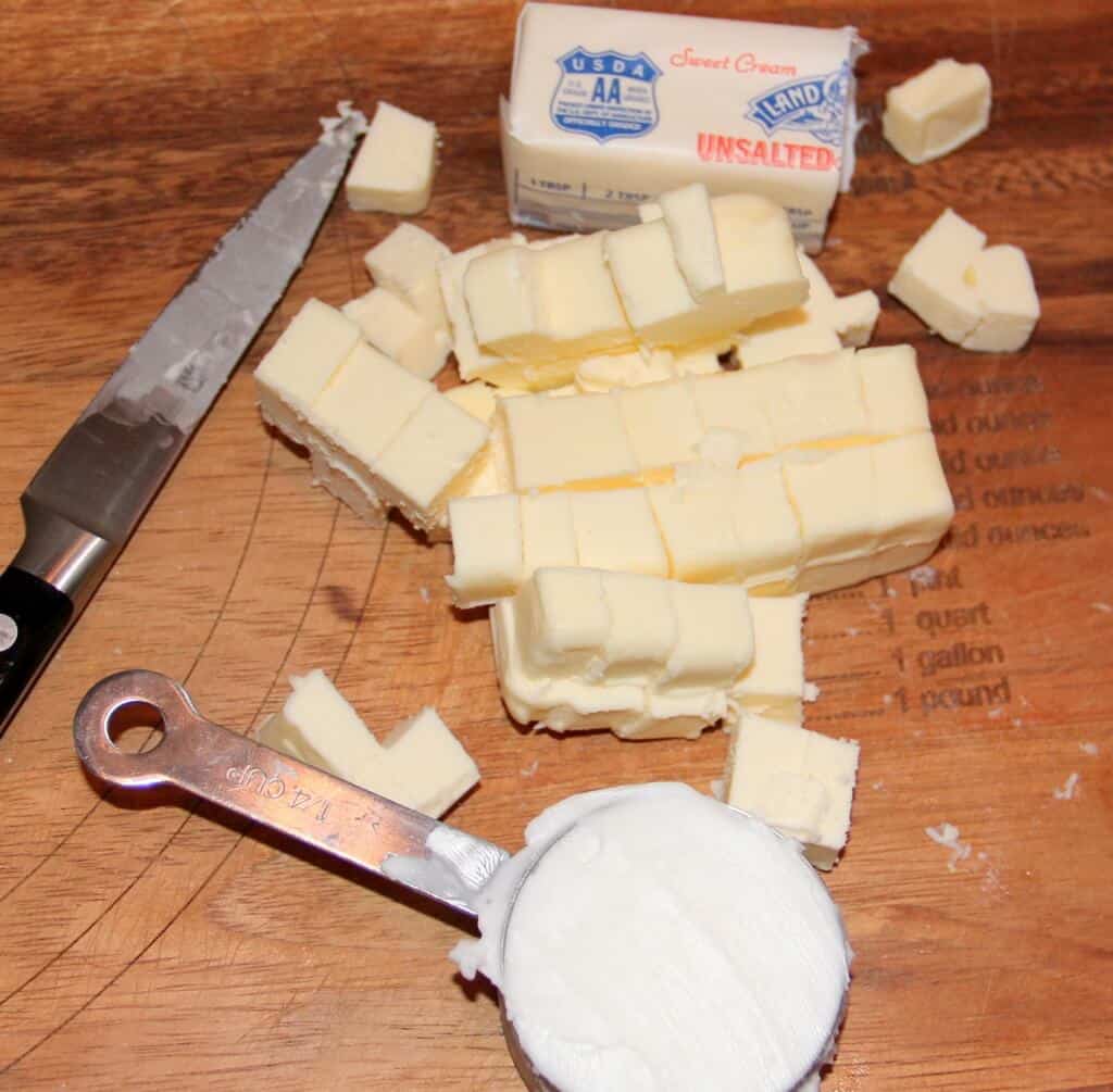 chunks of butter with a knife.