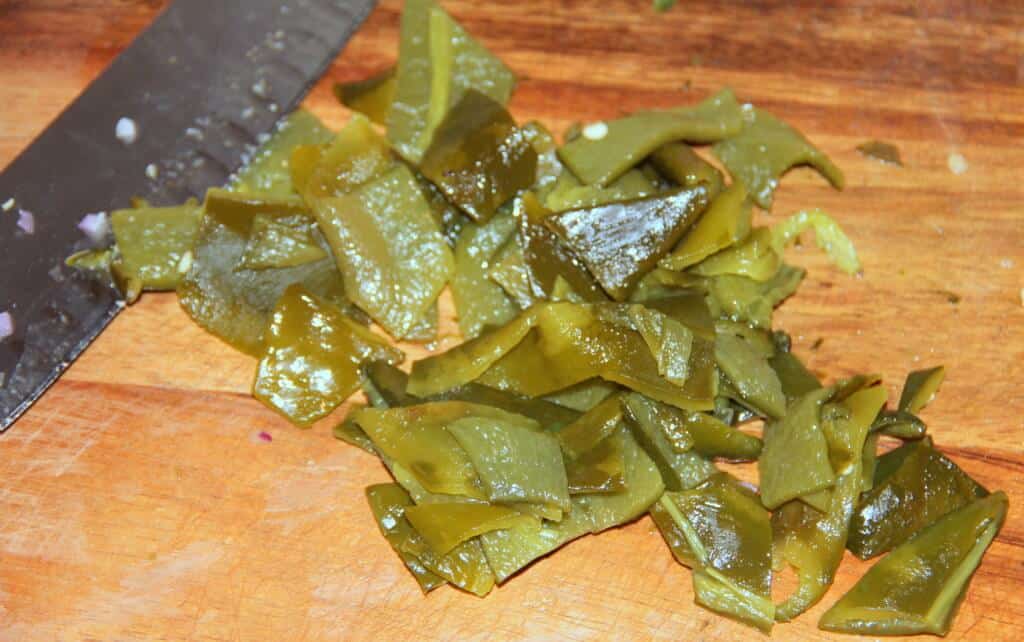 chopped roasted poblano peppers on a cutting board