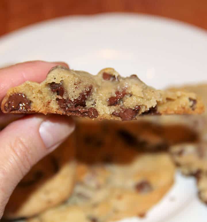 Side view of baked chocolate chip cookie.