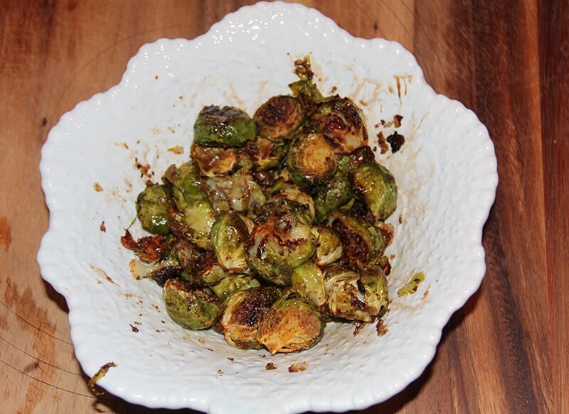 A bowl full of roasted brussels sprouts.