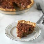 This Southern Pecan Pie recipe is a classic but swaps old-fashioned cane syrup for some of the corn syrup. The result is intense and delicious flavor, not just overwhelming sweetness!