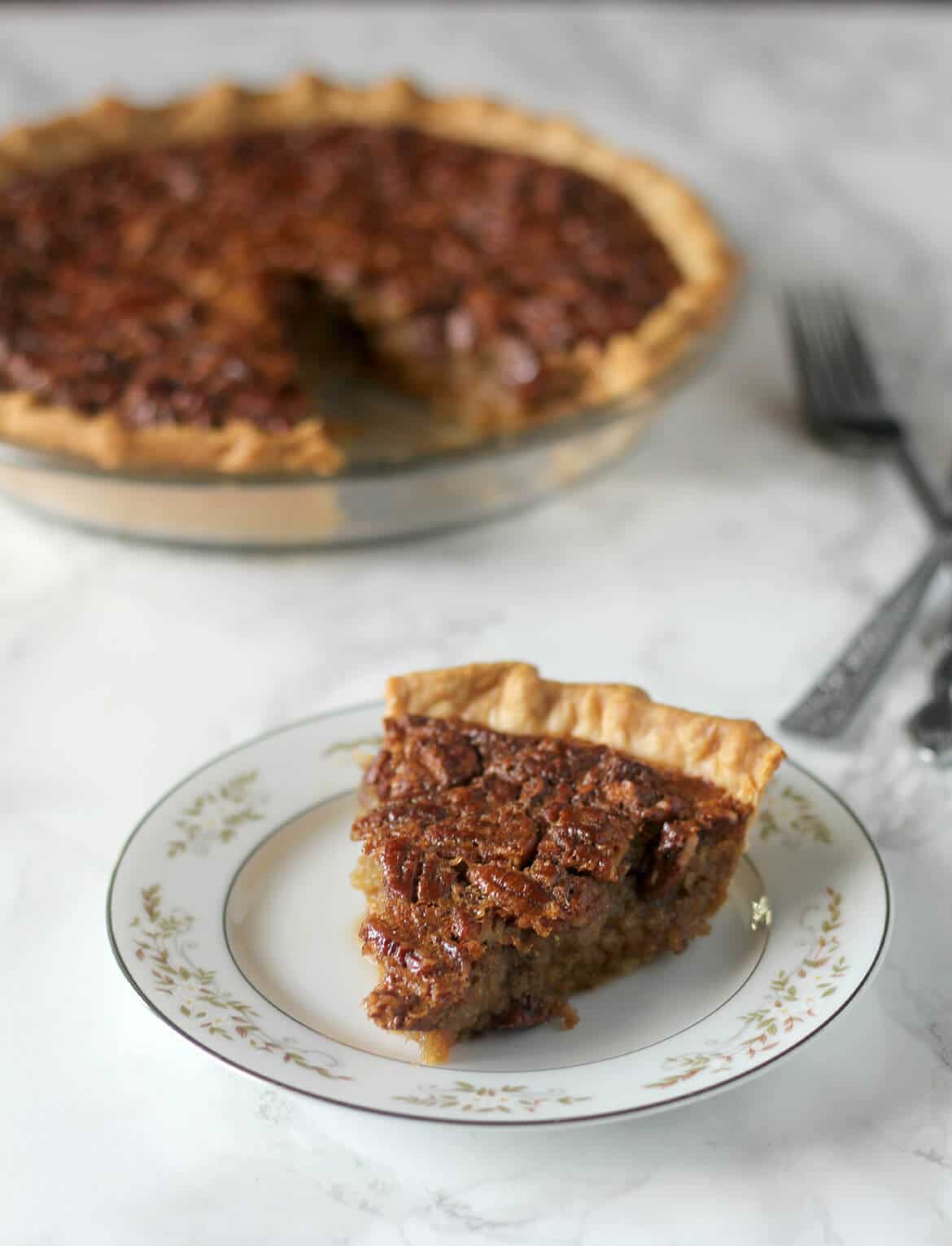 This Southern Pecan Pie recipe is a classic but swaps old-fashioned cane syrup for some of the corn syrup. The result is intense and delicious flavor, not just overwhelming sweetness! 