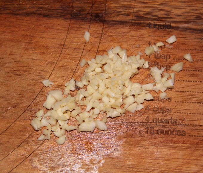 chopping garlic for honey cumin okra