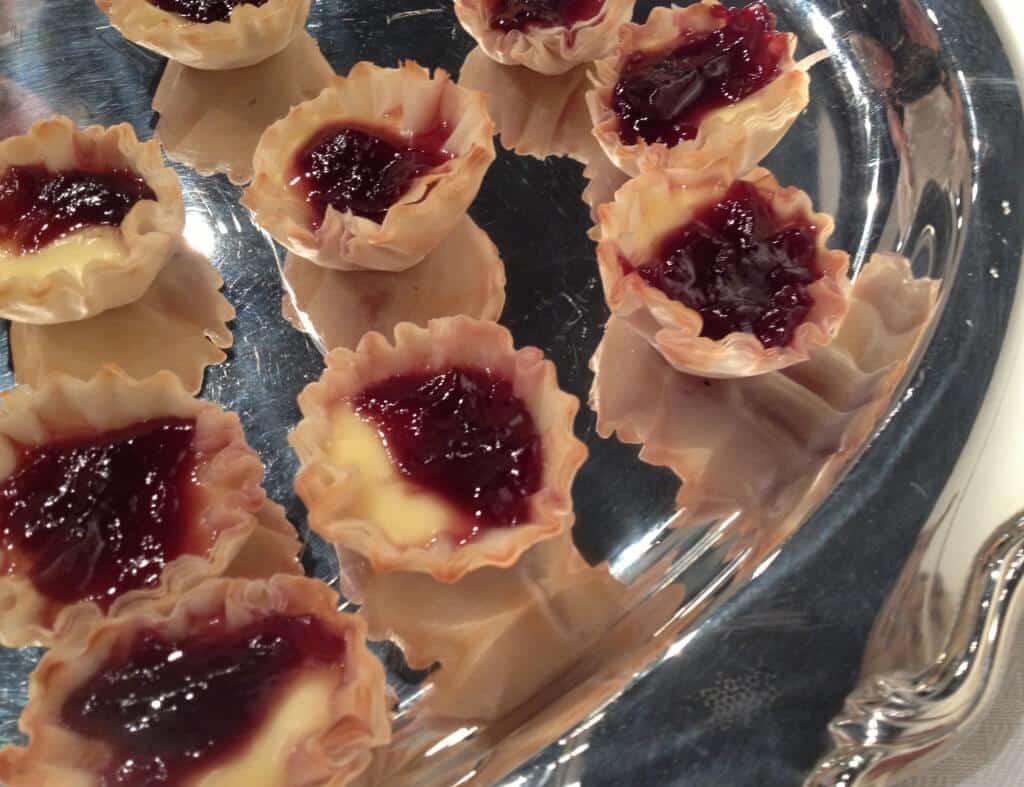 Brie Appetizer — mini tart shells filled with Brie and topped with raspberry preserves are super easy and delicious! | inasouthernkitchen.com