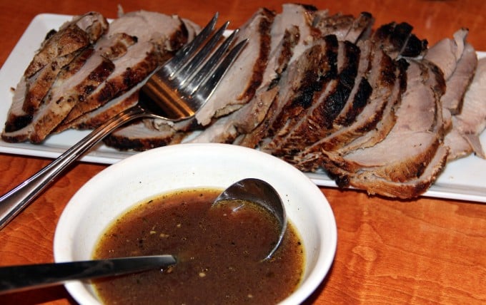 cider brined pork roast sliced on a platter