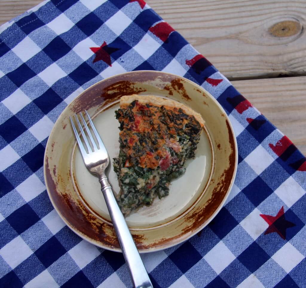 Tomato, Spinach and Cheese Quiche--an Italian herb flavored quiche with Parmesan, Gruyere, and bacon