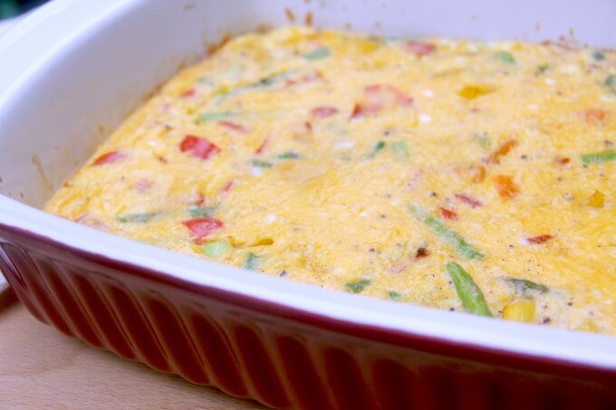 A red dish of a frittata.