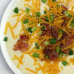 Easy Potato Soup that's ready in 45 minutes—it's creamy, buttery, cheesy, comfort food! Top with all your favorite loaded potato toppings: bacon, scallions, and cheese.