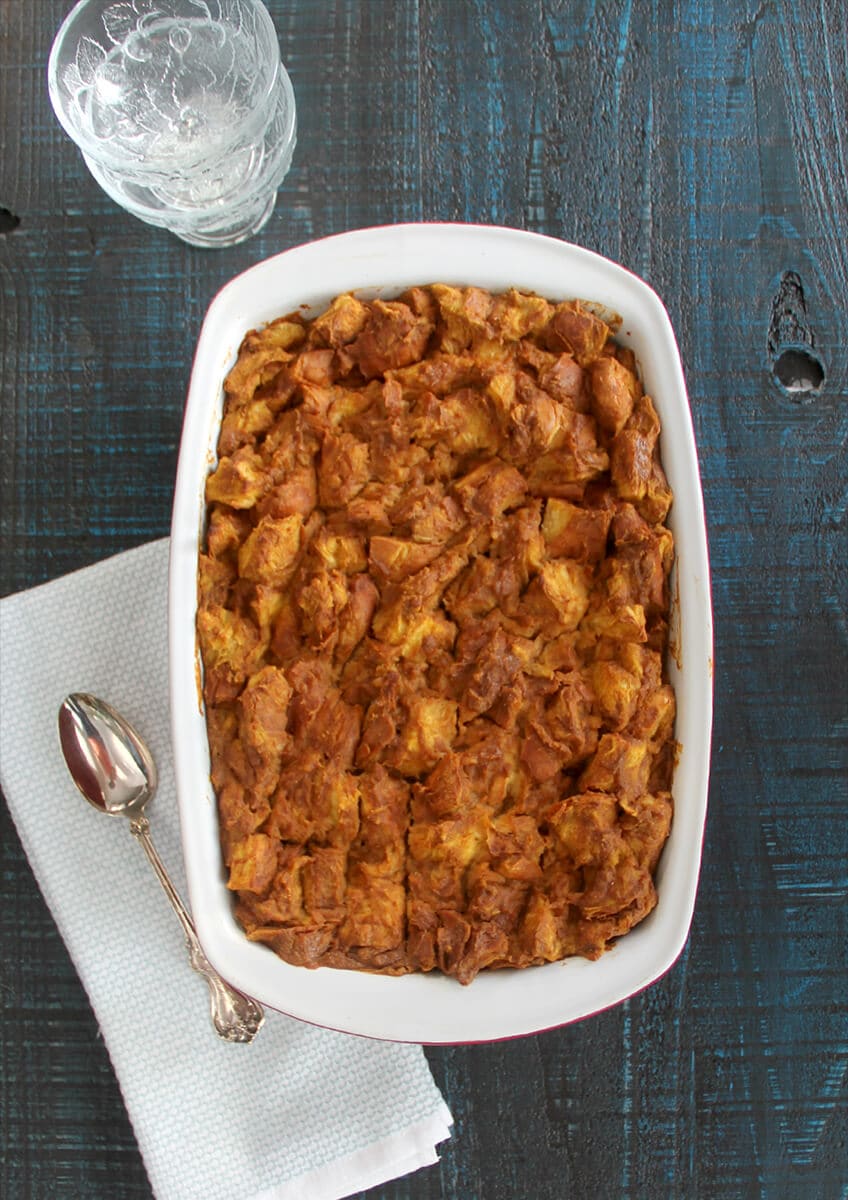 Overhead shot of whole dish of baked pumpkin bread pudding. 