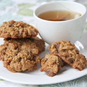 A plate of breakfast cookies and a cup of hot tea.