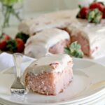A luscious strawberry sheet cake with fresh strawberries and cream cheese frosting.