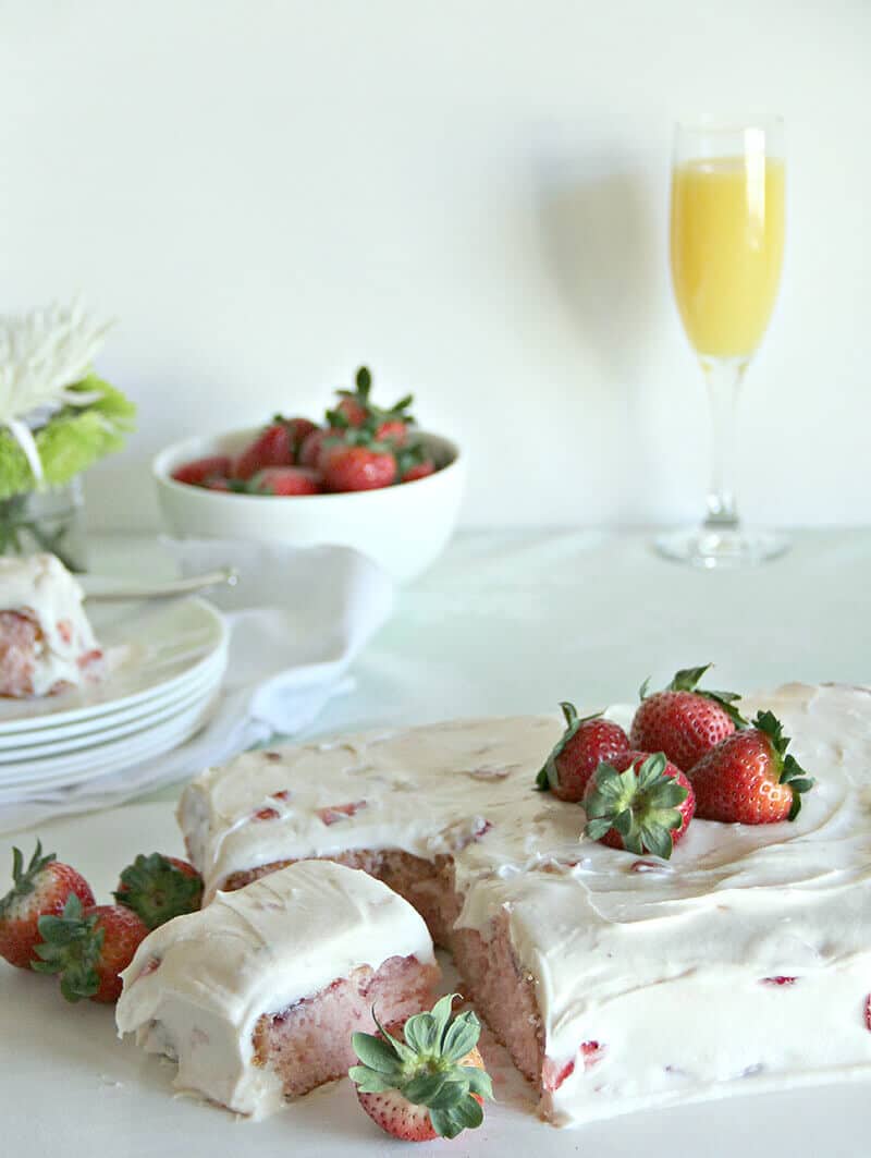 A luscious strawberry sheet cake with fresh strawberries and cream cheese frosting.