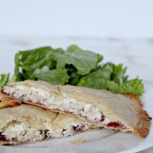 Side view of leftover turkey hand pies on a plate.