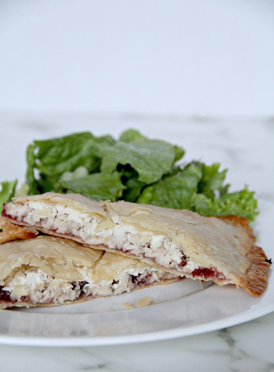 Side view of leftover turkey hand pies on a plate. 