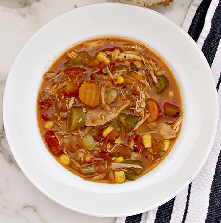 Chicken Vegetable Soup is filled with shredded chicken, butterbeans, corn, tomatoes, okra and onion—all frozen which means no chopping! Healthy, quick, and easy!