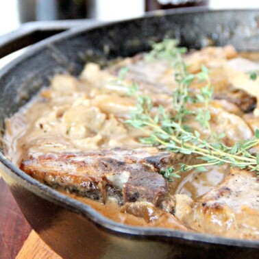 Pork Chops with Apples--a one-pot meal with pork chops, apples, sweet onions, and delicious sauce!