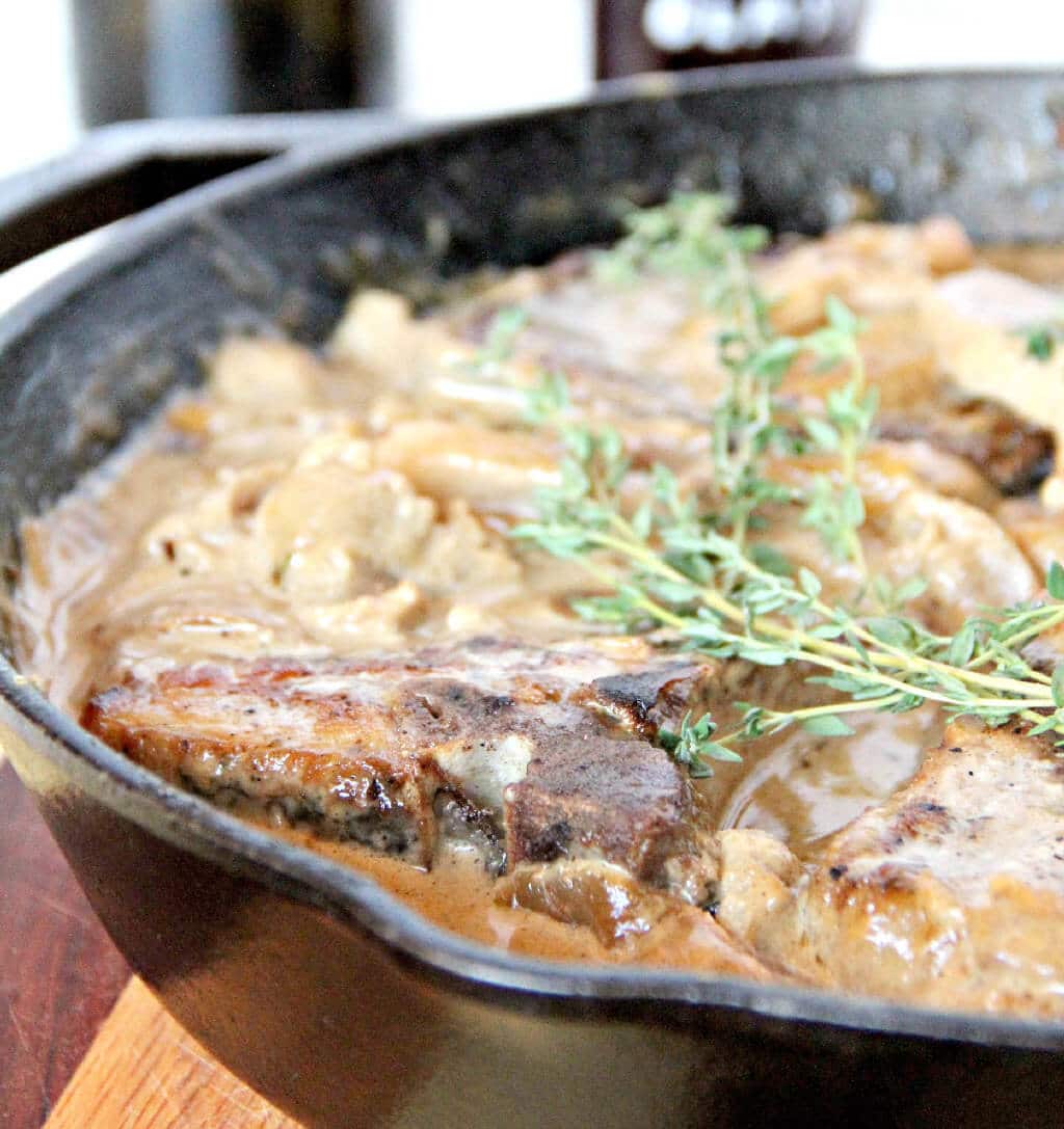 Pork Chops with Apples--a one-pot meal with pork chops, apples, sweet onions, and delicious sauce!