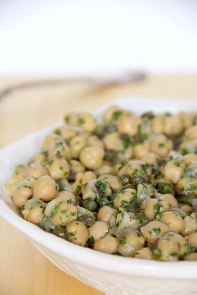 a white bowl of chickpea salad.