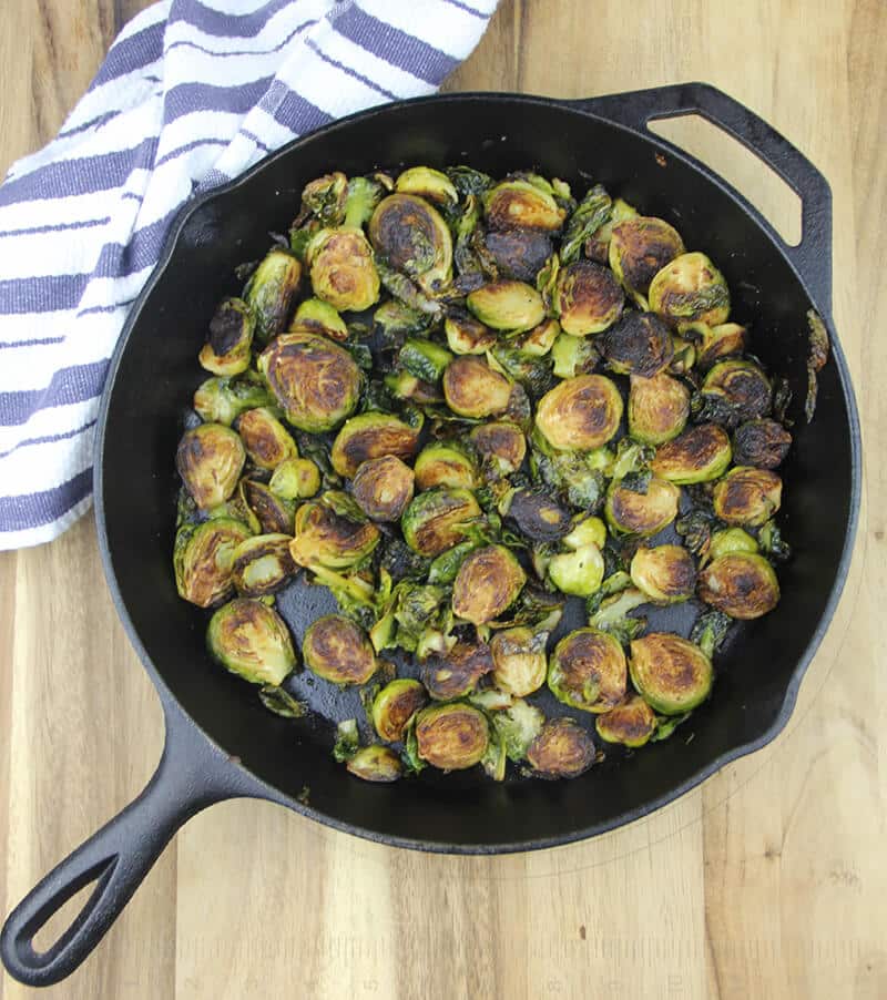 A skillet with sauteed brussels sprouts. 