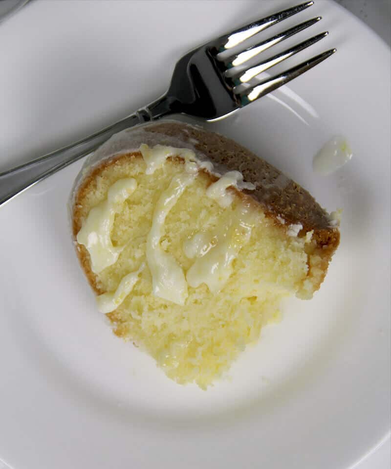 Easy Lemon Pound Cake with Lemon Glaze is a simple recipe using the Cream Cheese Pound Cake base and adding a zesty lemony glaze—it's fresh, pretty, and lip-smacking good!