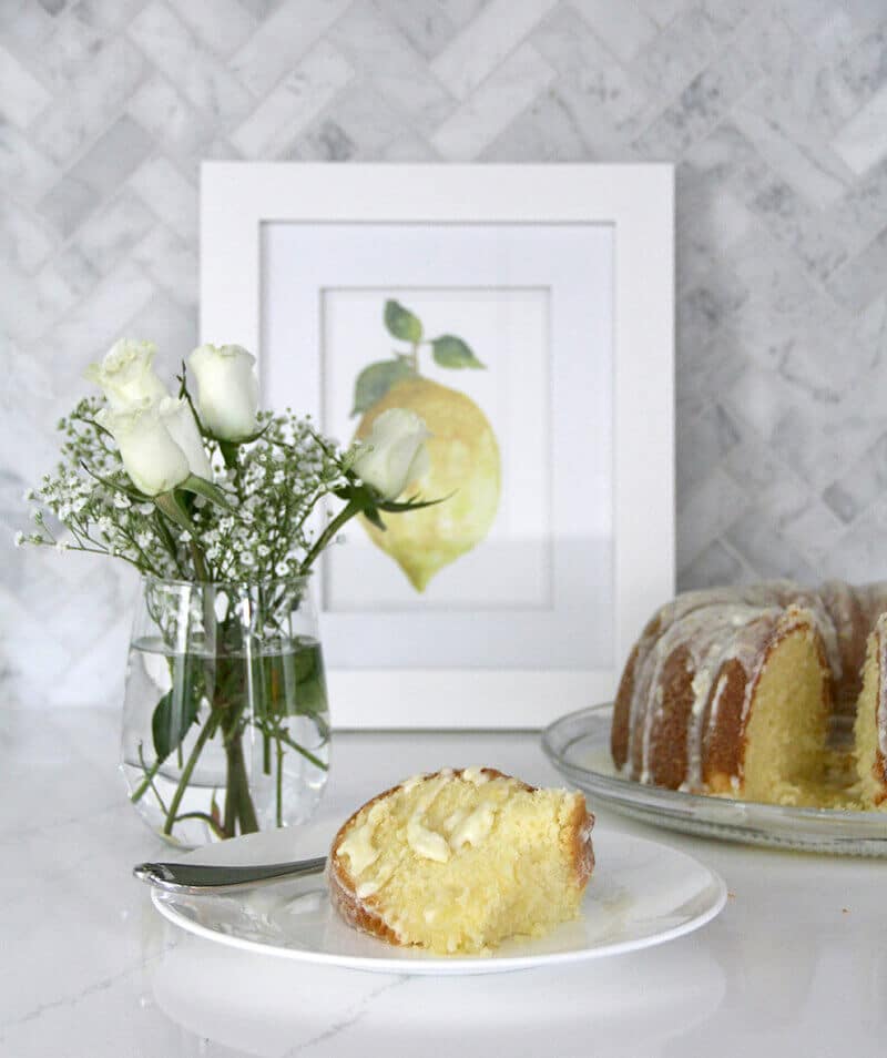 Easy Lemon Pound Cake with Lemon Glaze is a simple recipe using the Cream Cheese Pound Cake base and adding a zesty lemony glaze—it's fresh, pretty, and lip-smacking good!