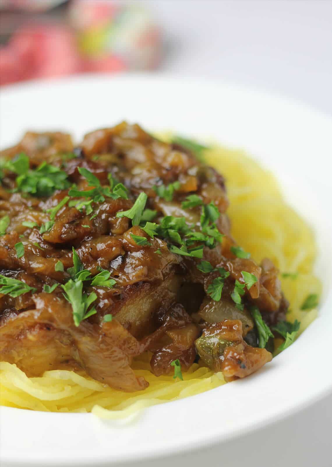 These amazing pork chops with caramelized onions, capers, and white wine are delicious with noodles, mashed potatoes, cheese grits, or spaghetti squash. 