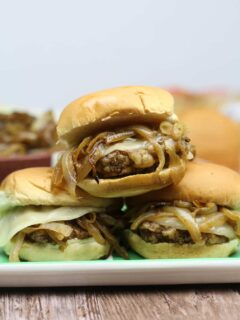 Country Fried Steak Sliders with Caramelized Onions will elevate your next tailgate to the knockout level! Wow your guests with these easy, tasty sliders!
