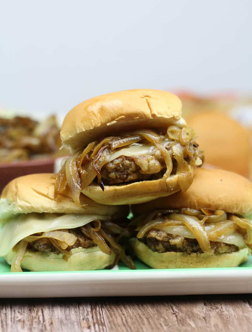 Country Fried Steak Sliders with Caramelized Onions will elevate your next tailgate to the knockout level! Wow your guests with these easy, tasty sliders!