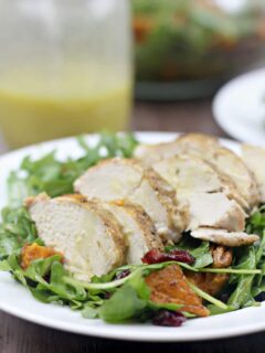 Arugula salad with roasted sweet potatoes, chicken, and honey-roasted pecans