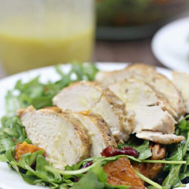 Arugula salad with roasted sweet potatoes, chicken, and honey-roasted pecans