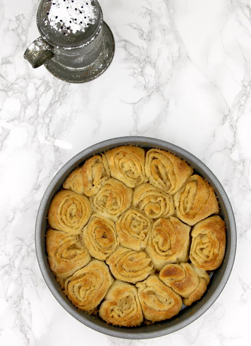 Pan of baked orange rolls.