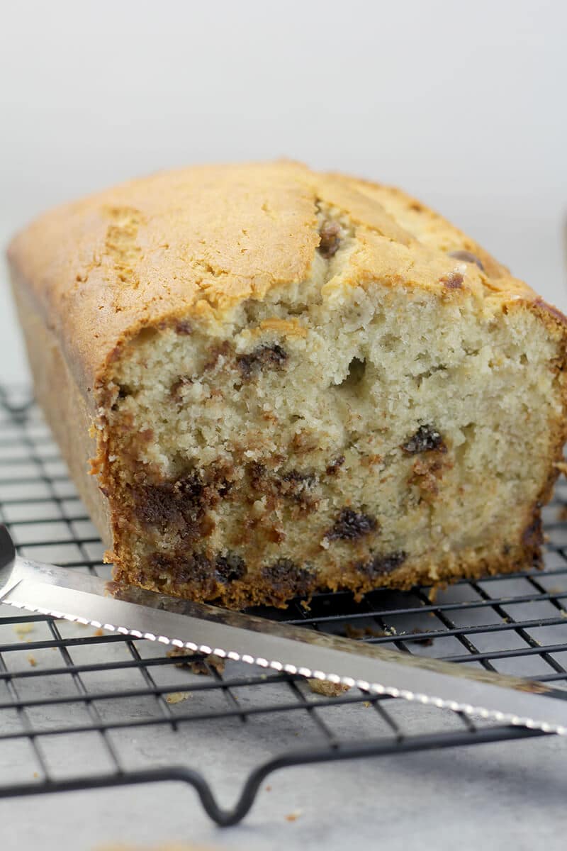 A side view of a cut loaf of Chocolate Chip Banana Bread. 