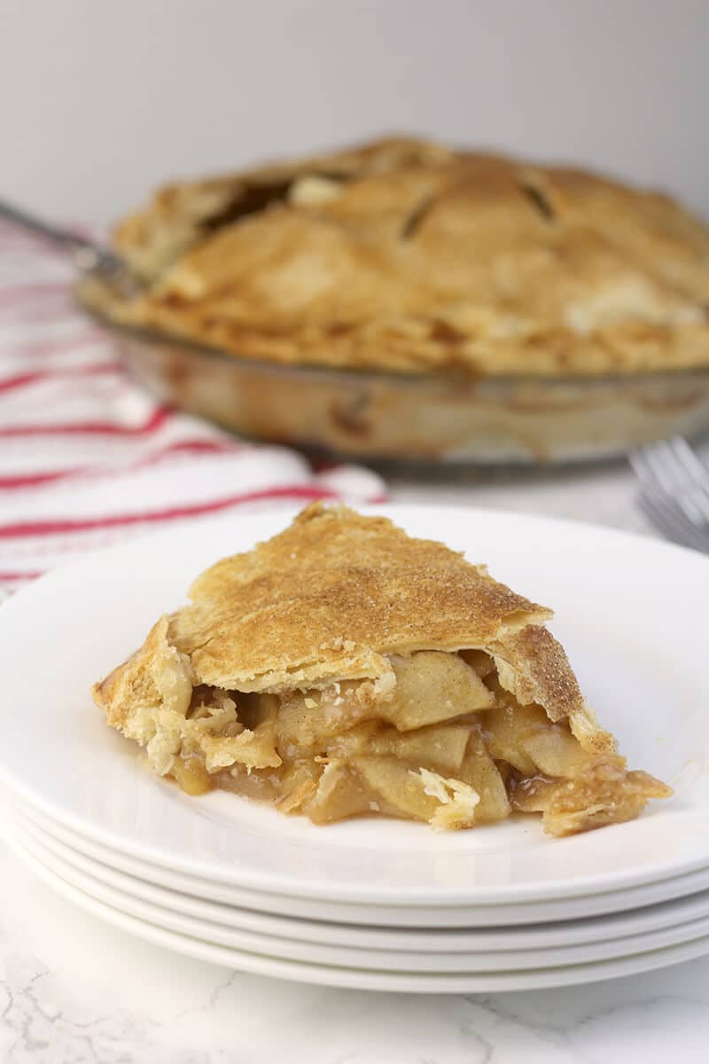 Double Crust Apple Pie slice on a plate.