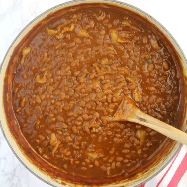 Dutch oven filled with Southern Baked Beans.