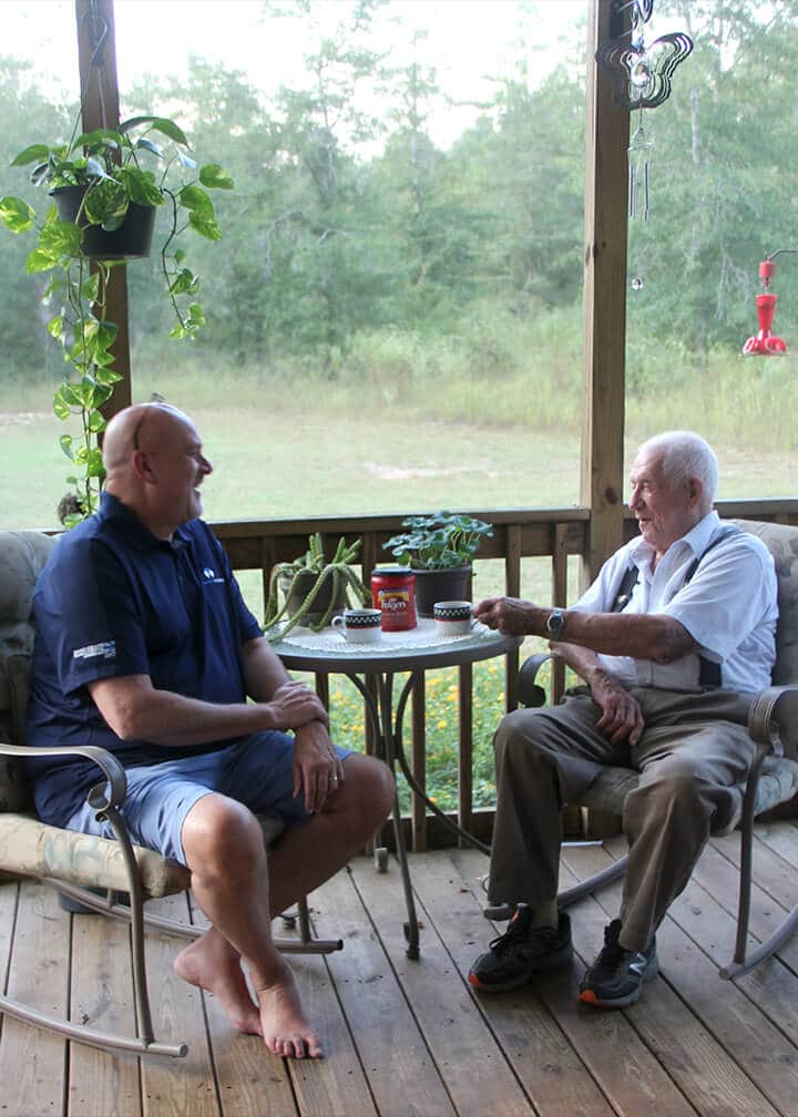 David talking to Jim on the porch. 