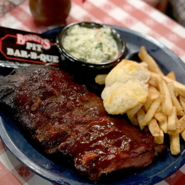 A plate of ribs, fries, slaw, and biscuit from Bennett's BBQ in Pigeon Forge.