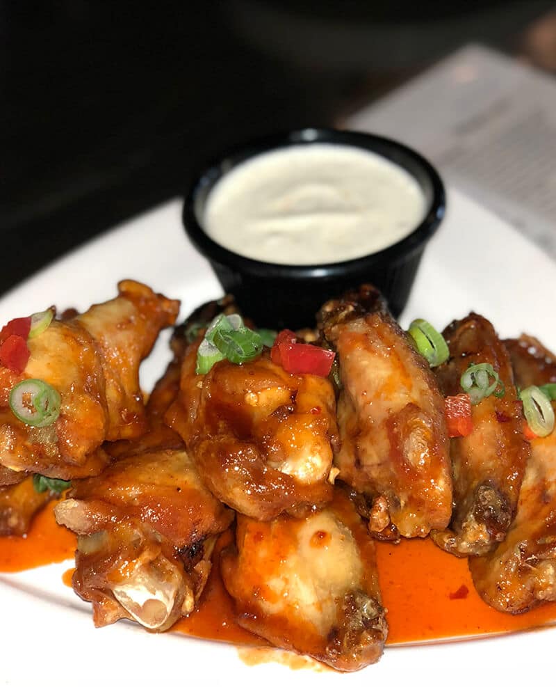 A plate of strawberry sriracha wings from Local Goat.