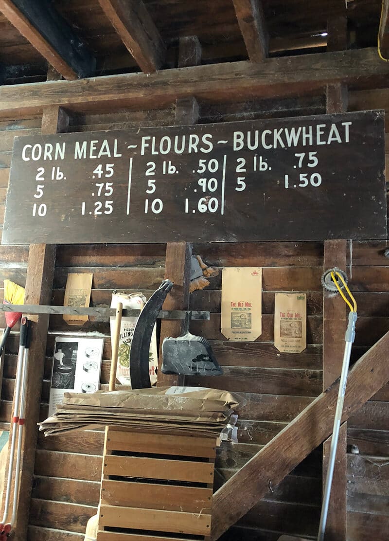 An old sign with the prices of cornmeal and flours in the Old Mill Pigeon Forge. 