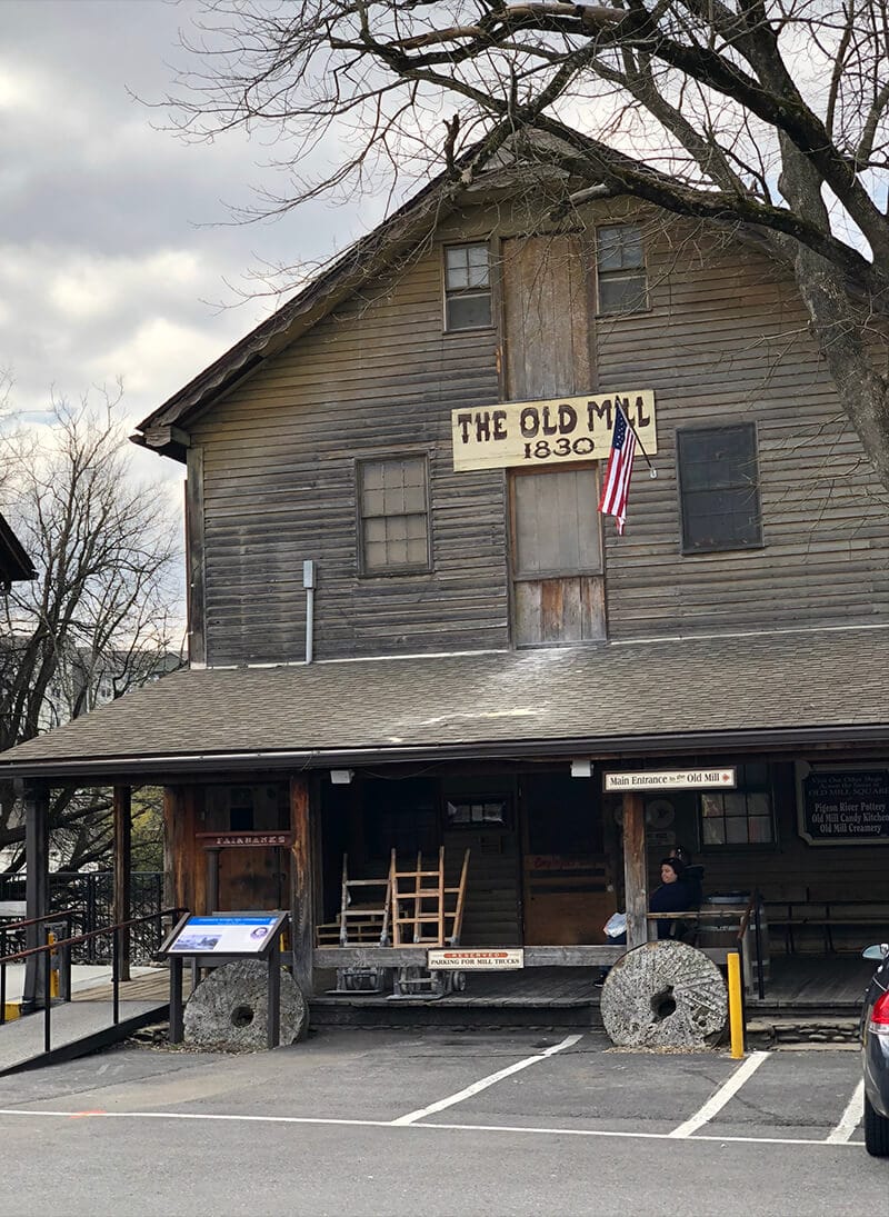The outside of the Old Mill Pigeon forge, a wooden structure built in the 1800s, a favorite of Pigeon Forge attractions.