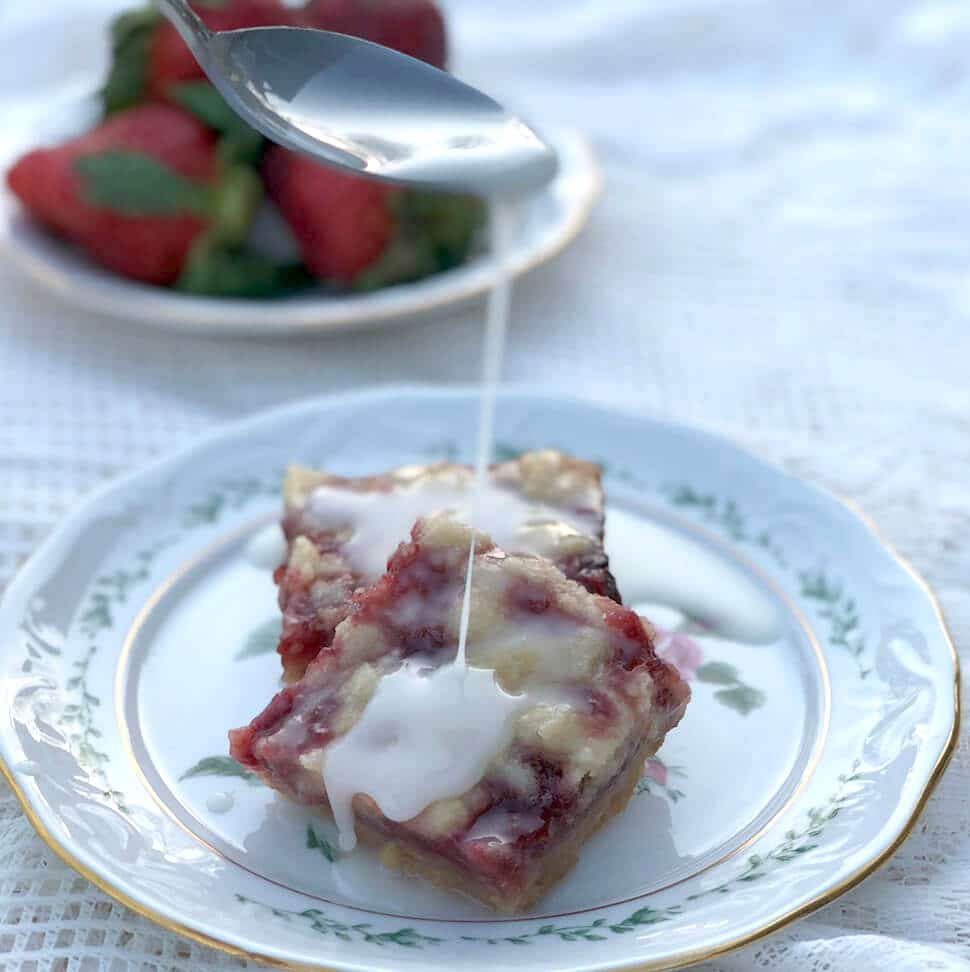 Strawberry Bars with Lemon Glaze are made with strawberry jam, fresh strawberries, and a buttery