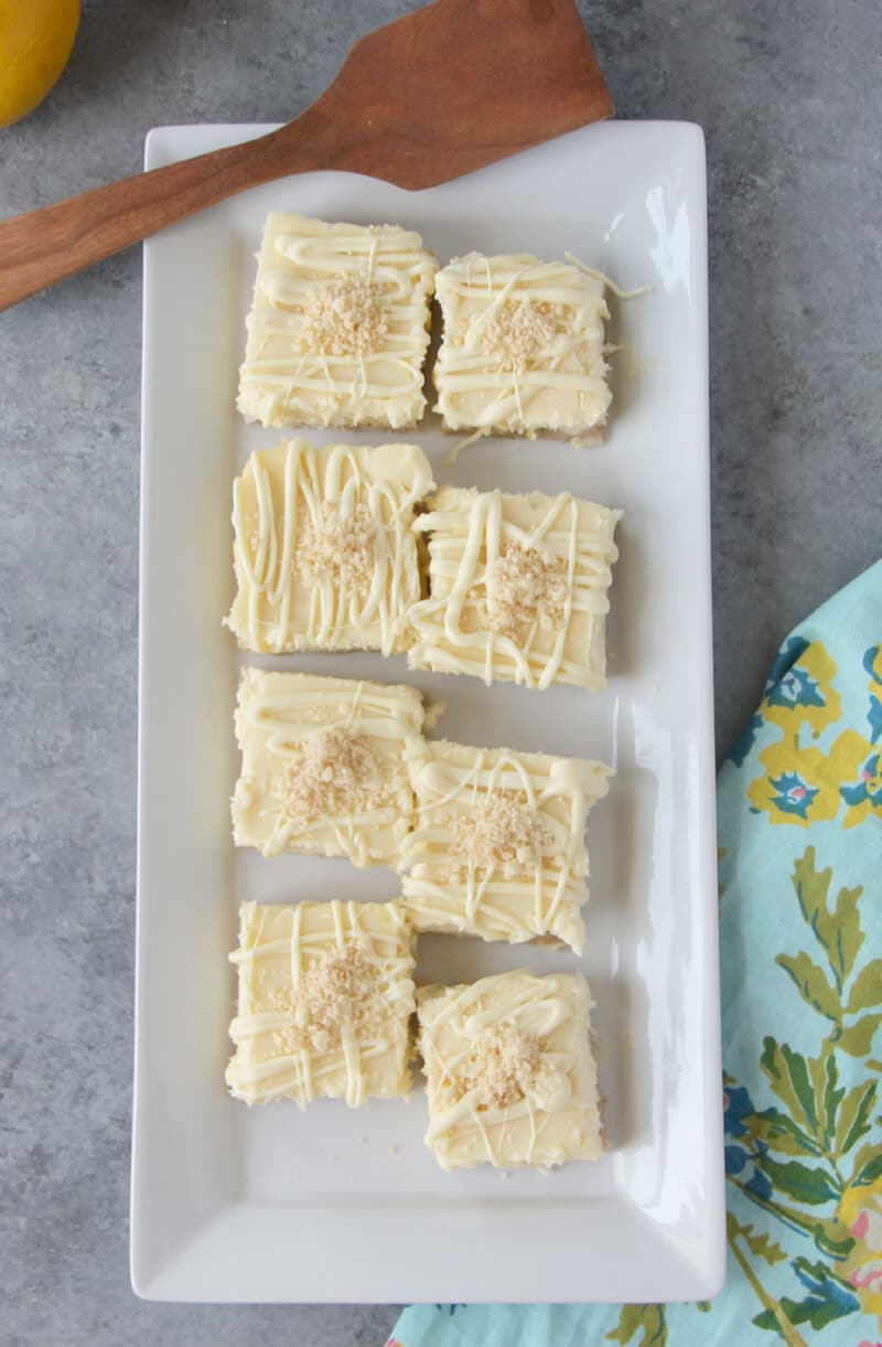 A platter of white chocolate cheesecake bars.