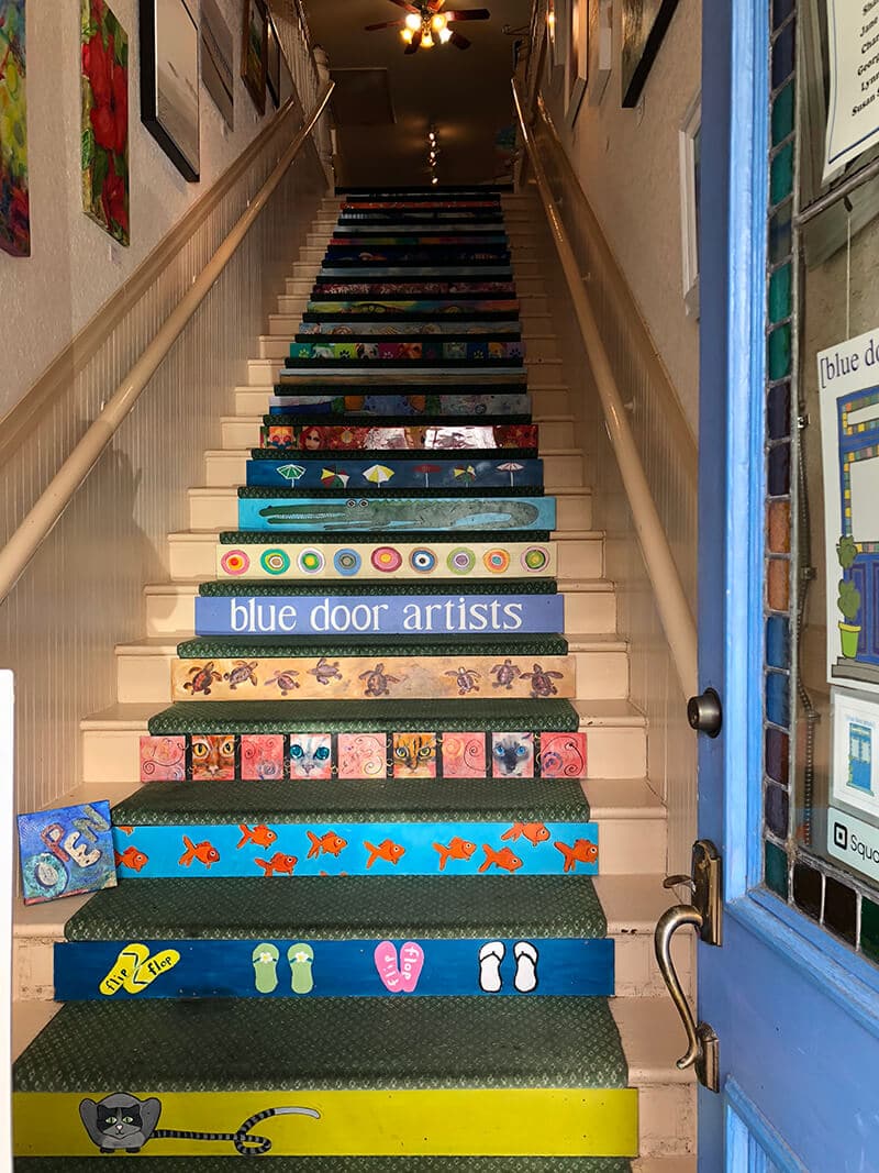 Painted stairs leading up to the Blue Door Artists studio in Amelia Island.