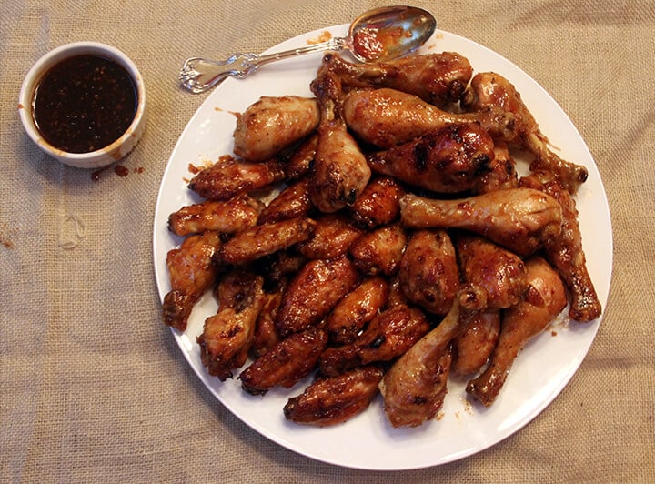 Overhead view of a plate of honey sriracha wings.